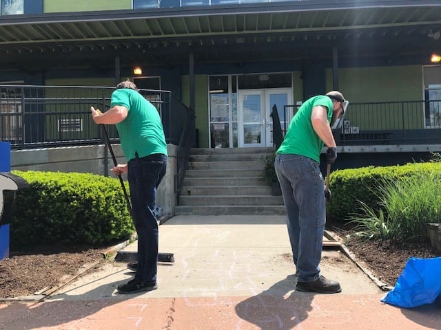 Sweeping Sidewalk Volunteers Sense Charter School