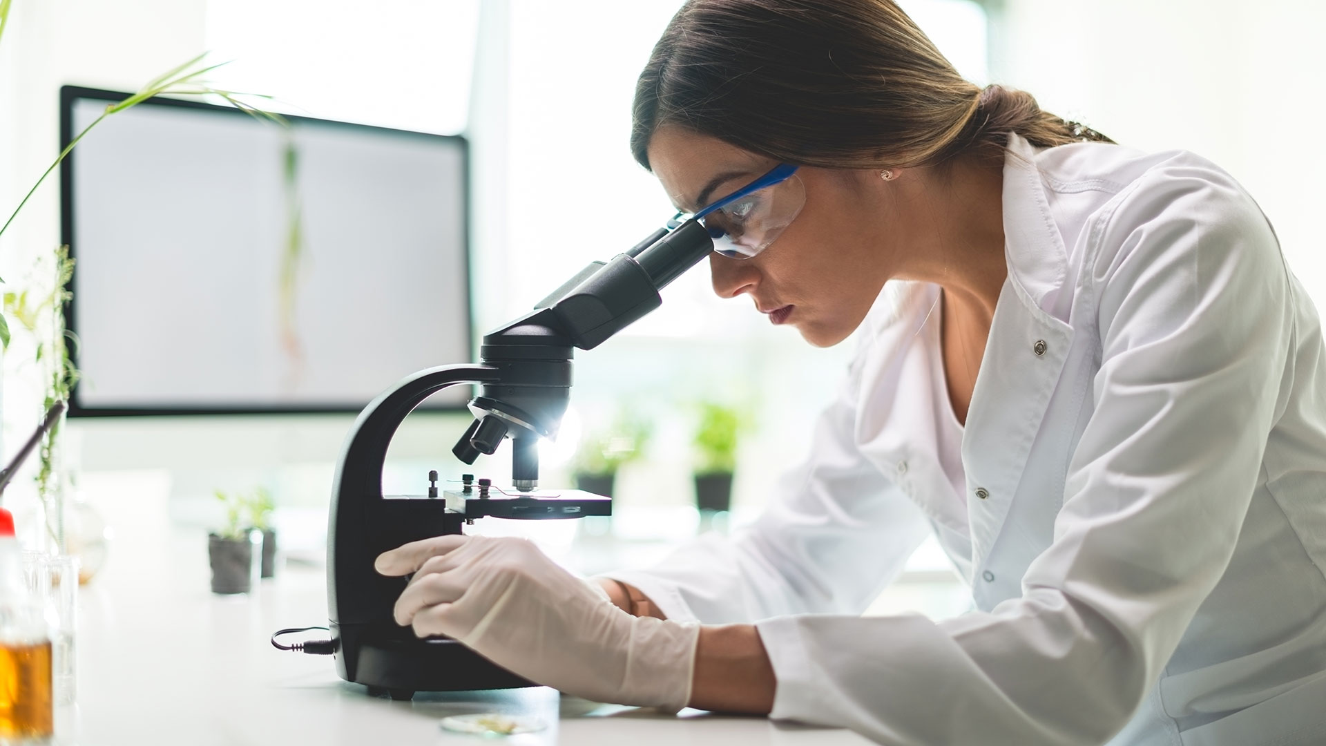 american research university lab employee microscope