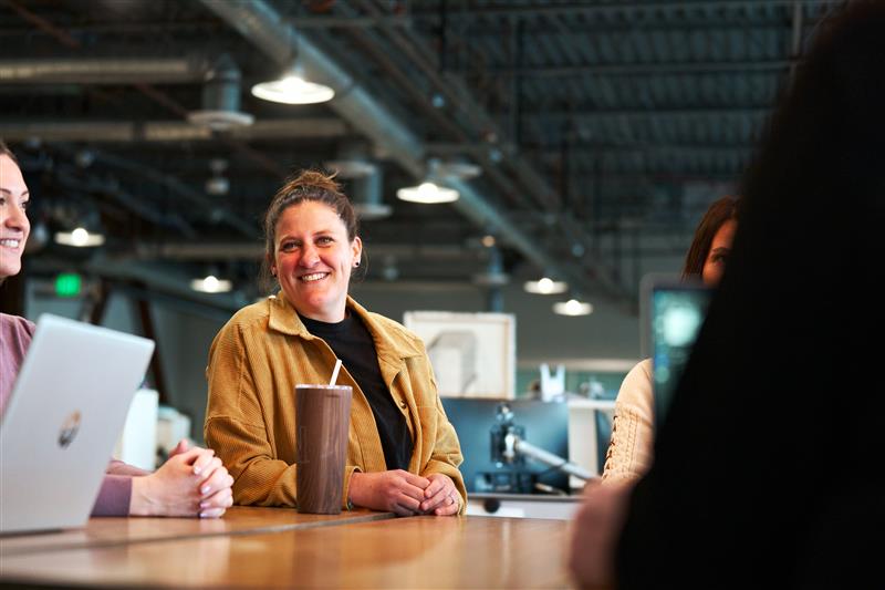 Arcwood employee sitting at a conference table